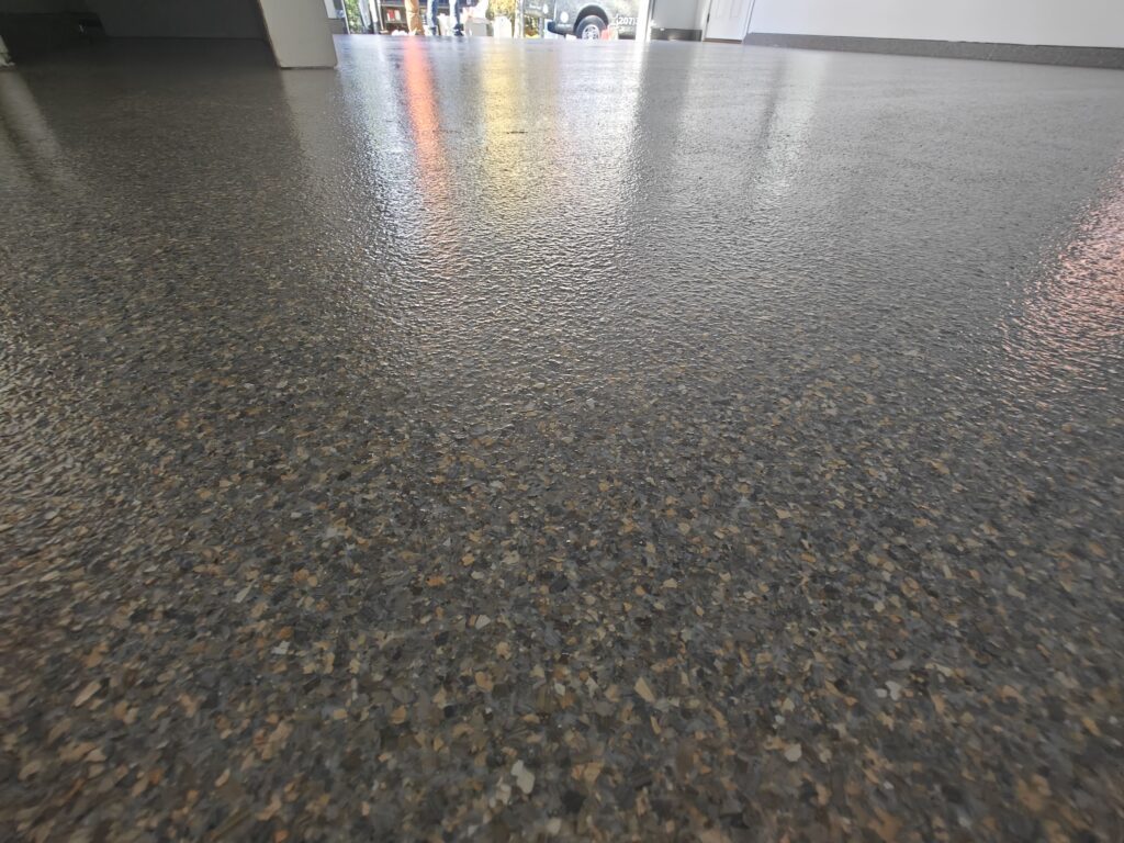 1300 sq ft of Tennessee Flake on this garage and apartment floor Garage Epoxy Flooring by Epoxy Pros of New England-min