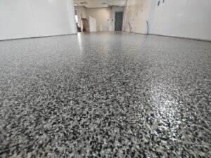 Commercial Epoxy Flooring in Aroma Joe’s Coffee double broadcast flake epoxy concrete coating-min