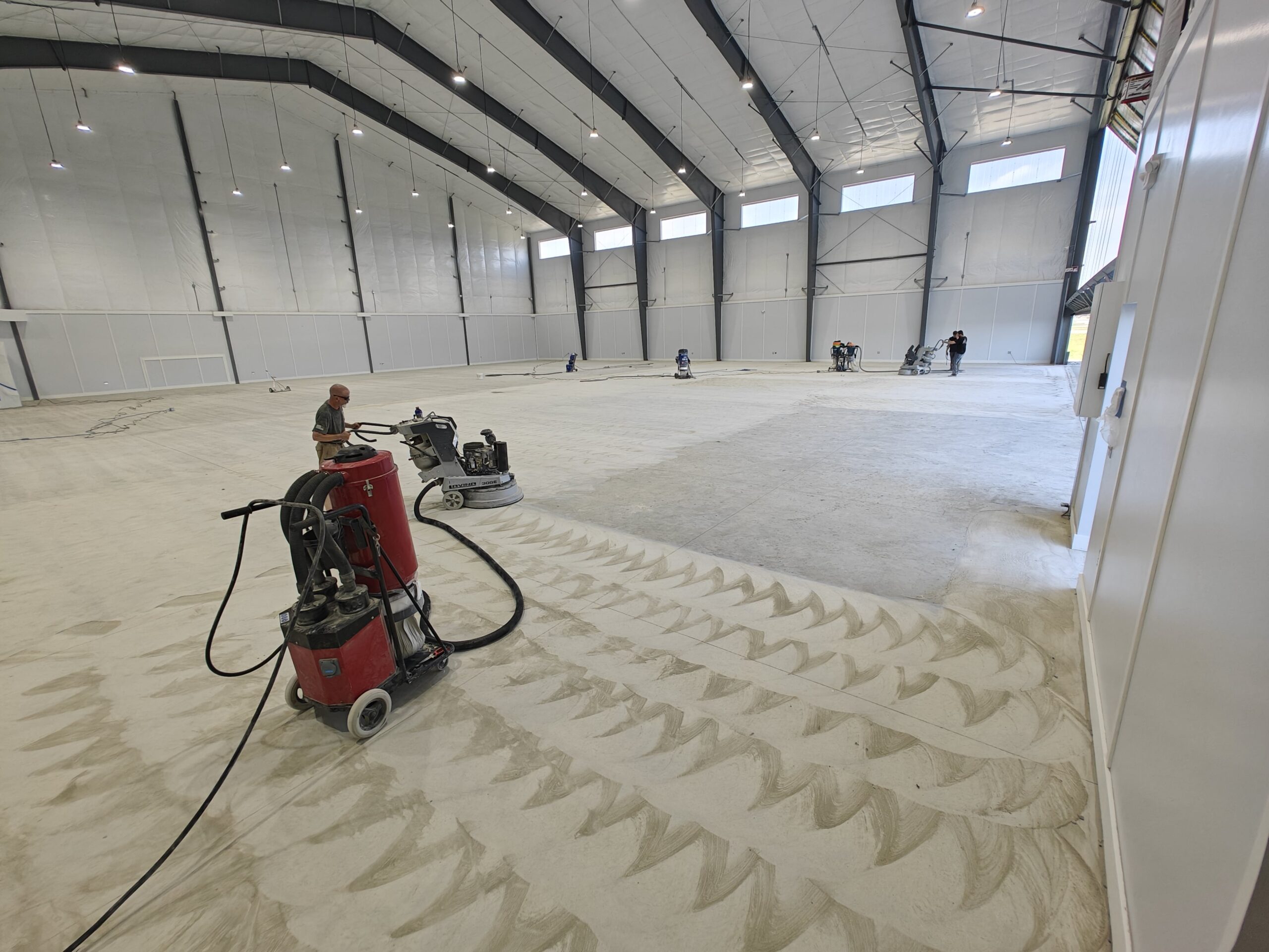 Hanger - 15,000 sq ft of white epoxy with aliphatic urethane top coat at Sanford Seacoast Regional Airport-min